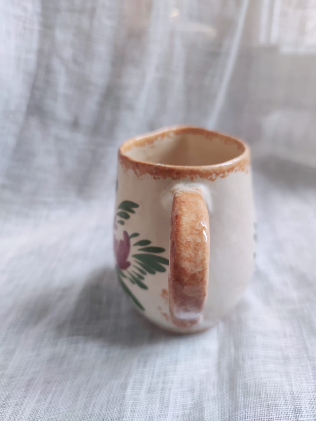 Small hand-painted pitcher