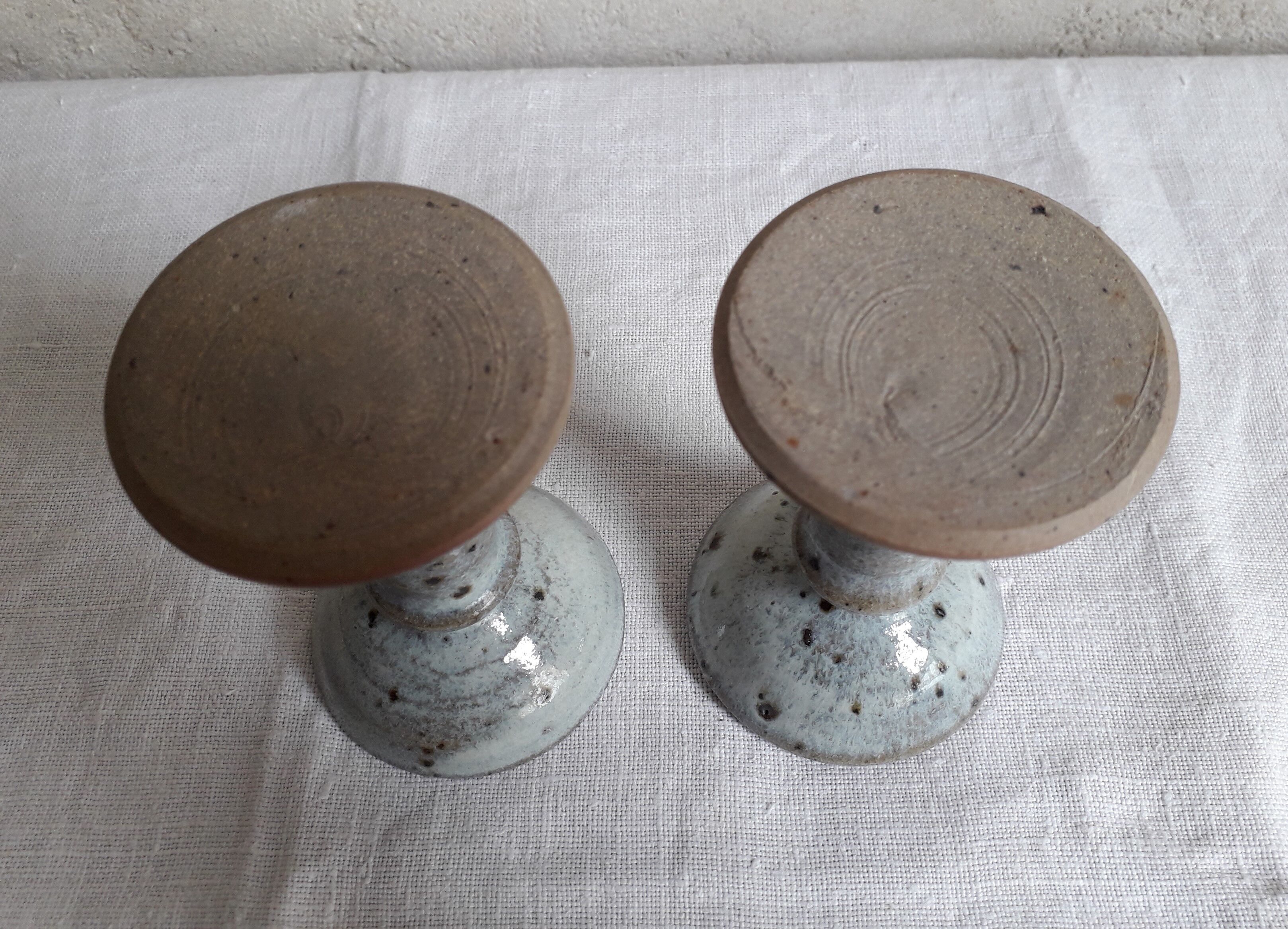Pair of sandstone candlesticks