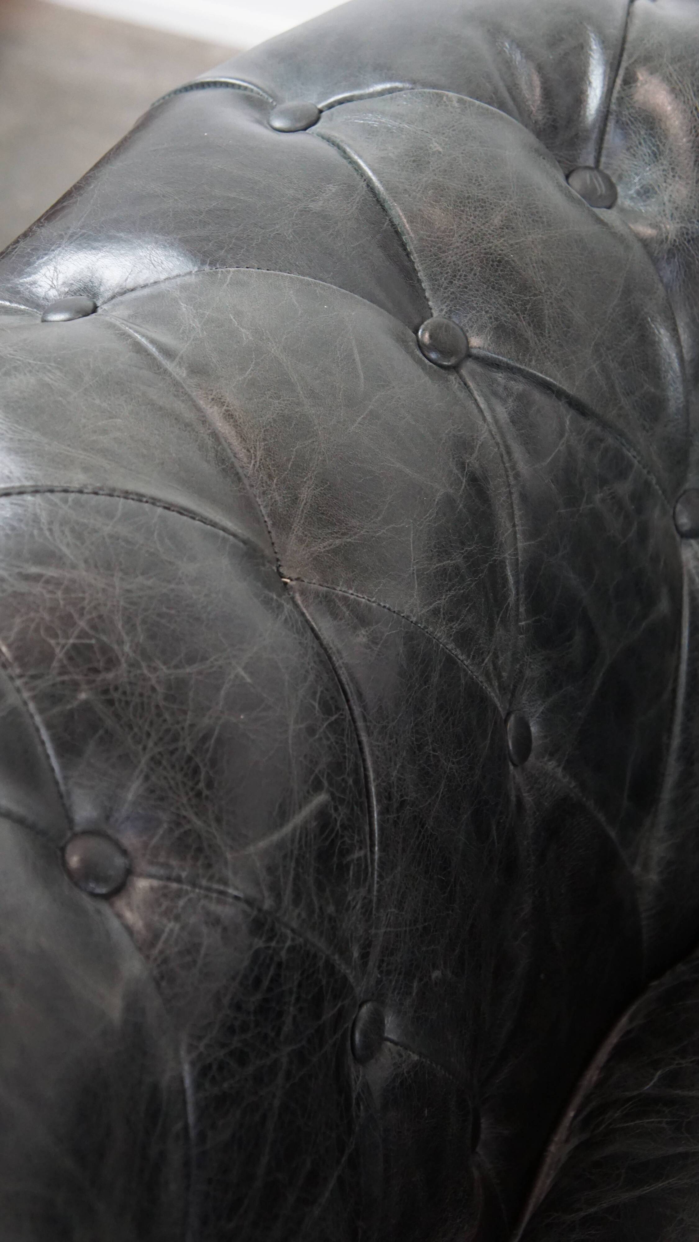 Set of 2 black Chesterfield armchairs in grained cowhide leather