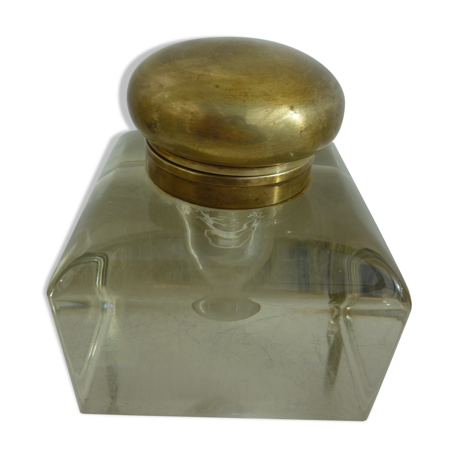 Old and imposing thick glass desk inkwell, gold brass lid