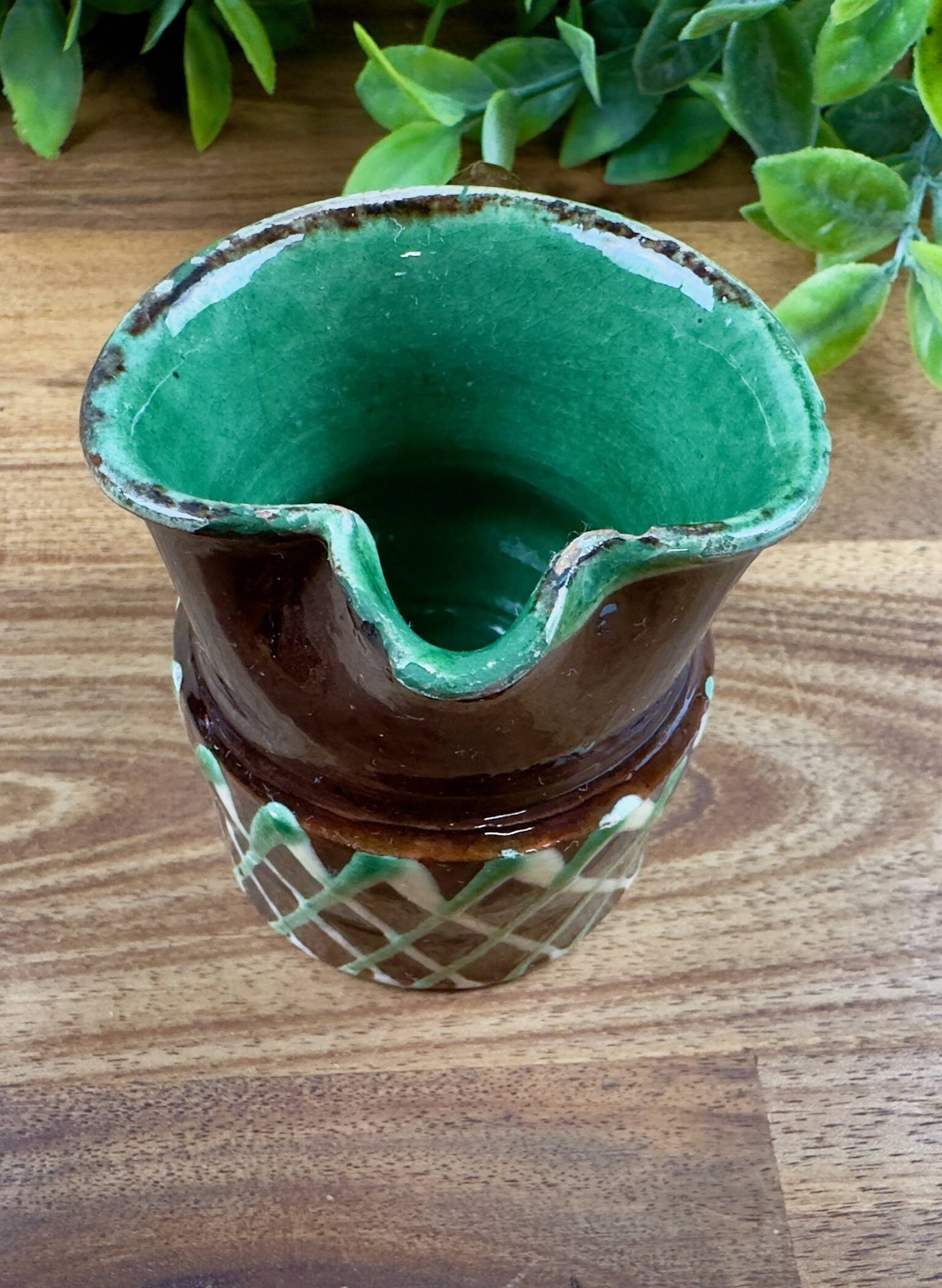Small vintage ceramic jug in brown glazed with geometric design.