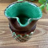 Small vintage ceramic jug in brown glazed with geometric design.