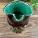 Small vintage ceramic jug in brown glazed with geometric design.