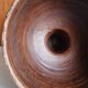 Cup on a pedestal in handcrafted scarified ceramic.