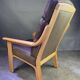 Chocolate leather armchair, wooden structure