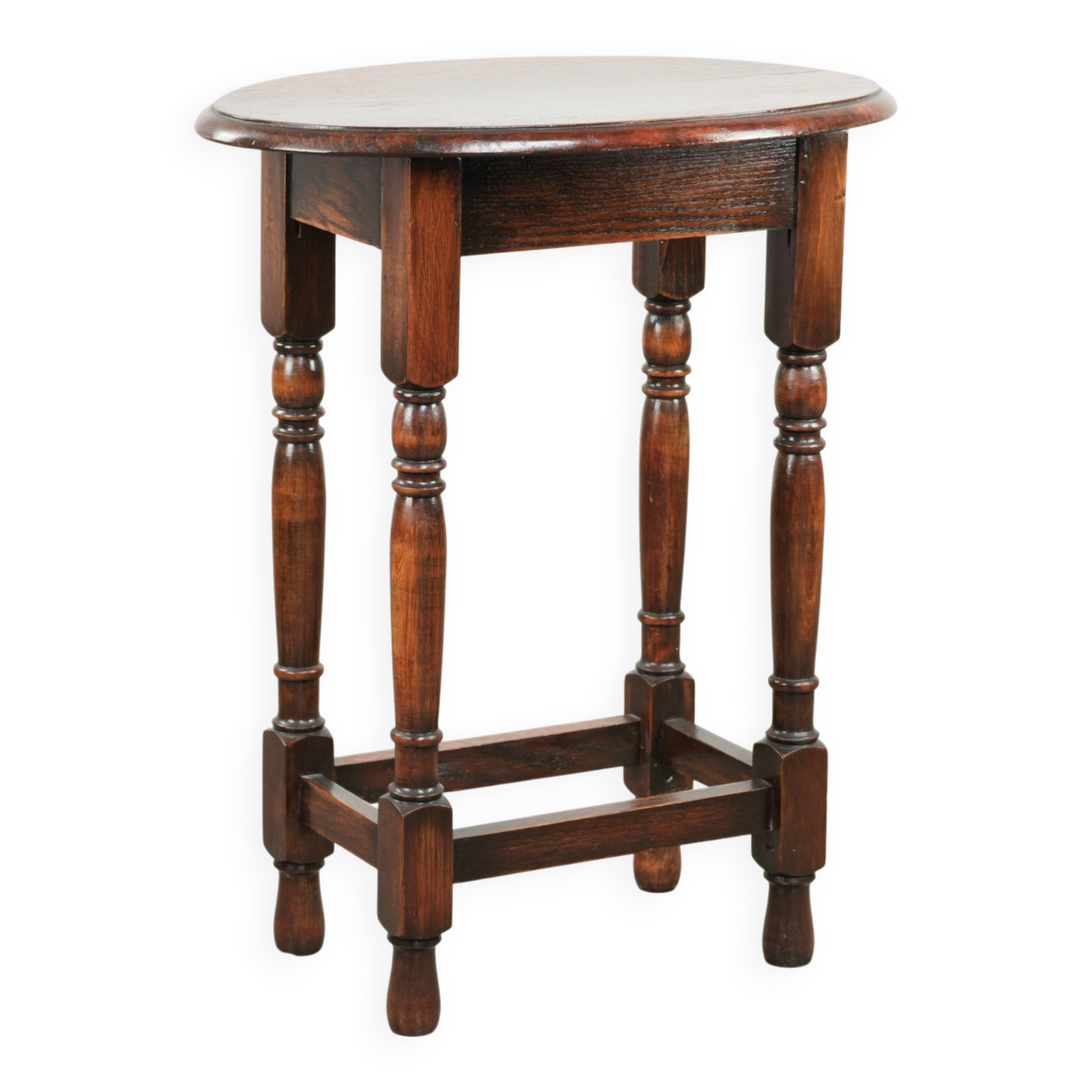 Antique oval English oak side table from the early 20th century