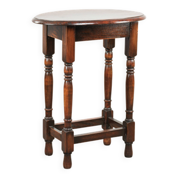 Antique oval English oak side table from the early 20th century