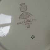 Eight hollow plates decorated with lobsters