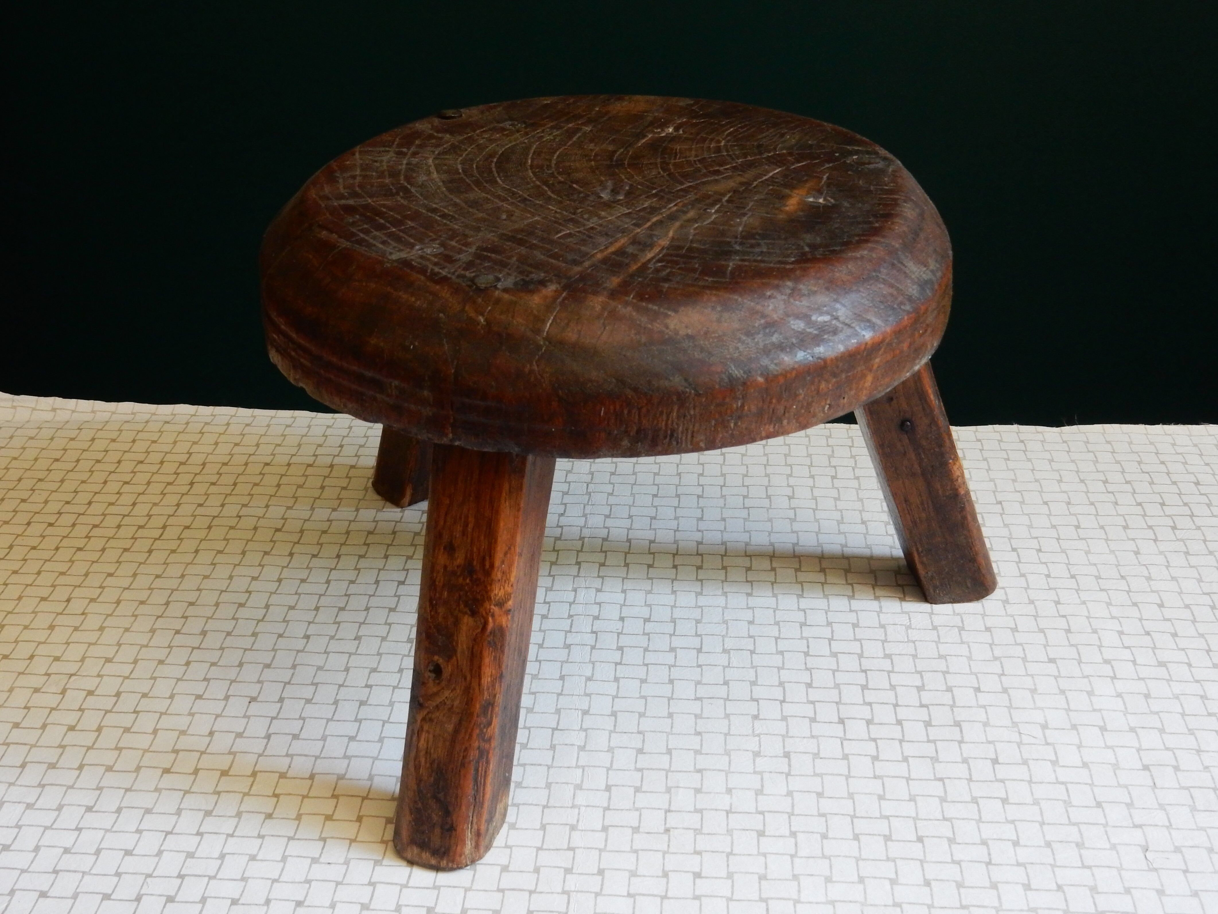 Small wooden farm tripod stool