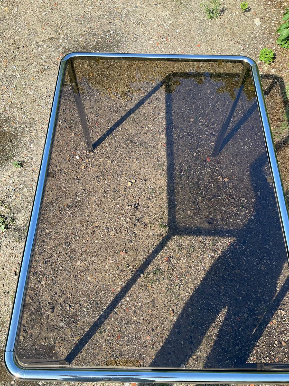 70s dining table in tubular chrome metal and smoked glass