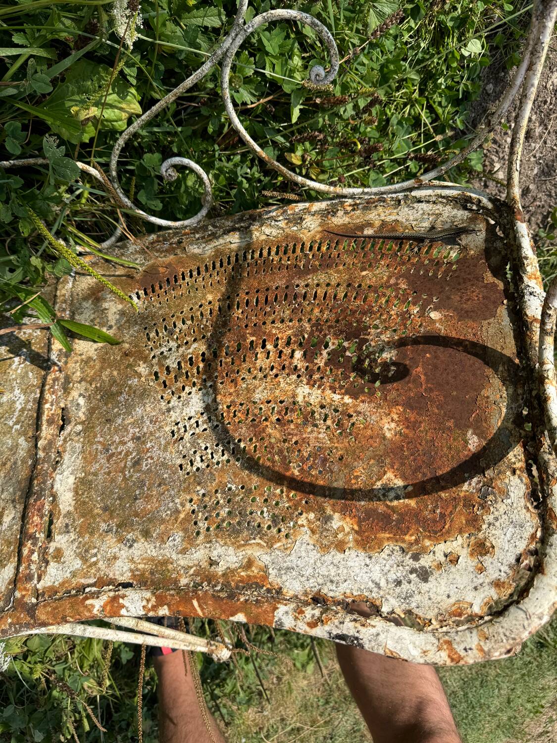 Wrought iron half-moon bench