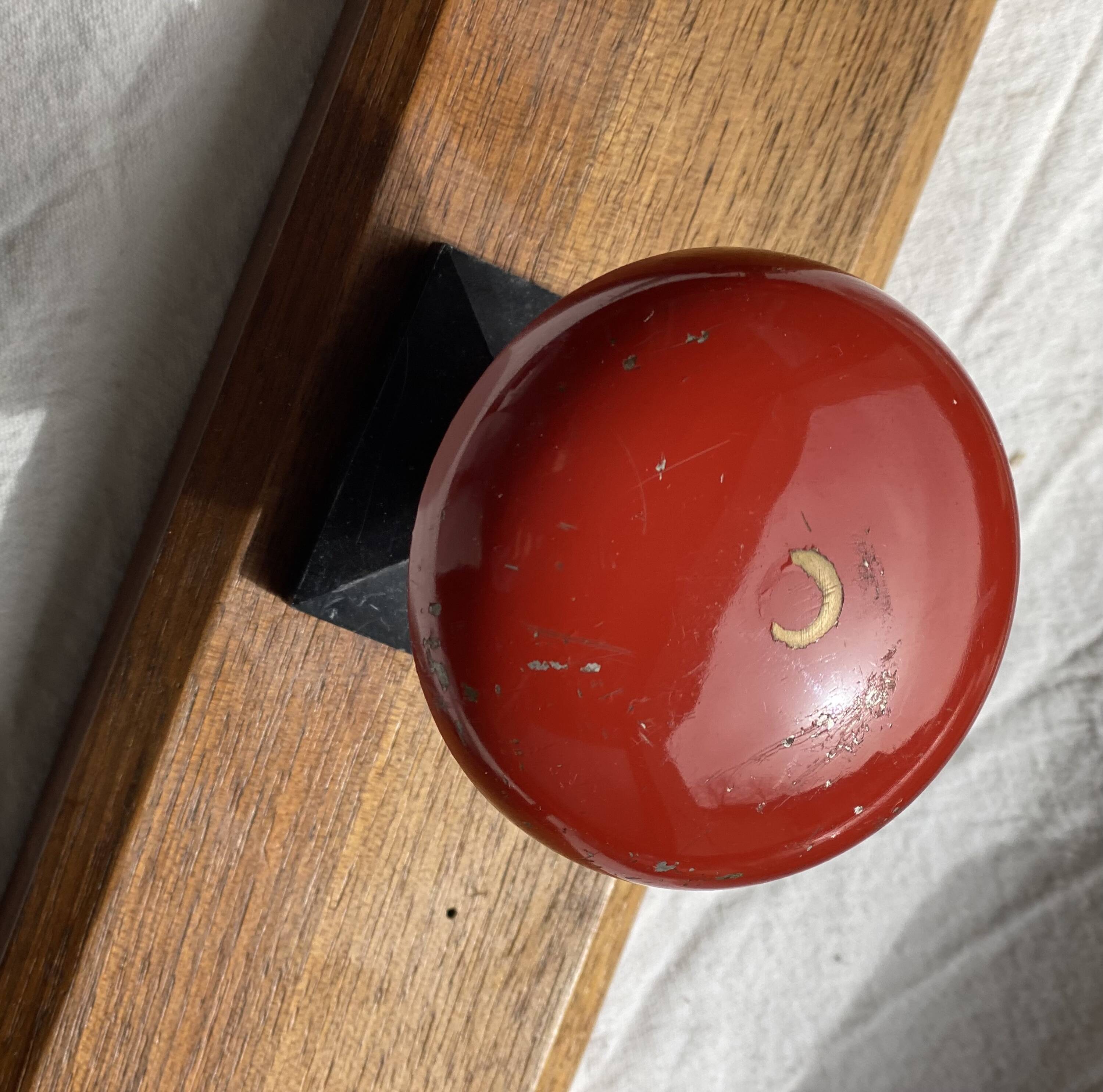 Wall-mounted coat rack with 3 hooks, vintage 1960s red lacquered metal.