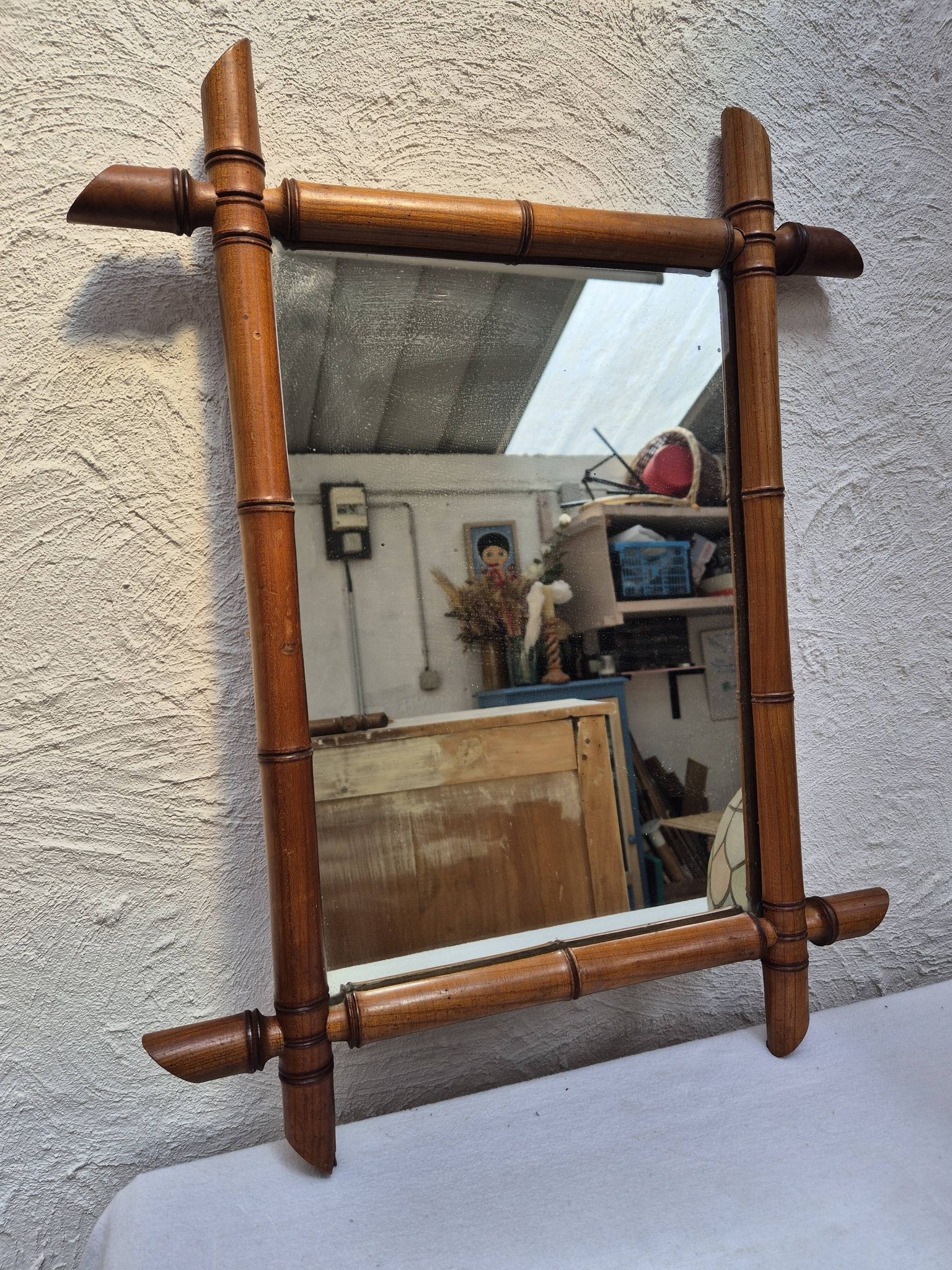 Vintage wooden mirror imitating bamboo