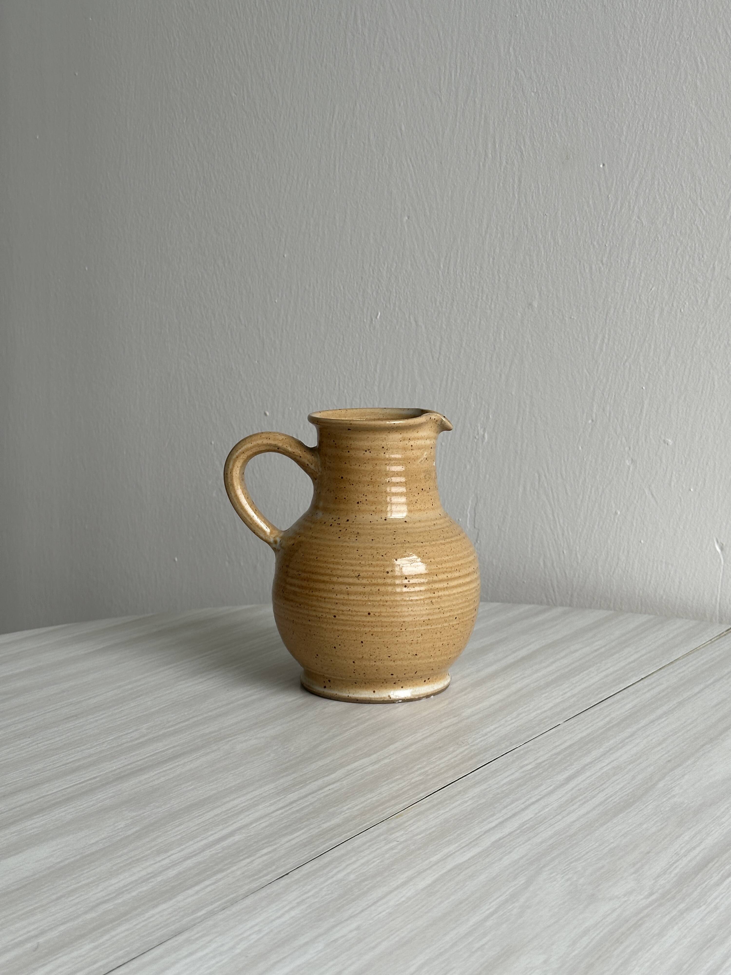Hand-thrown ceramic pitcher
