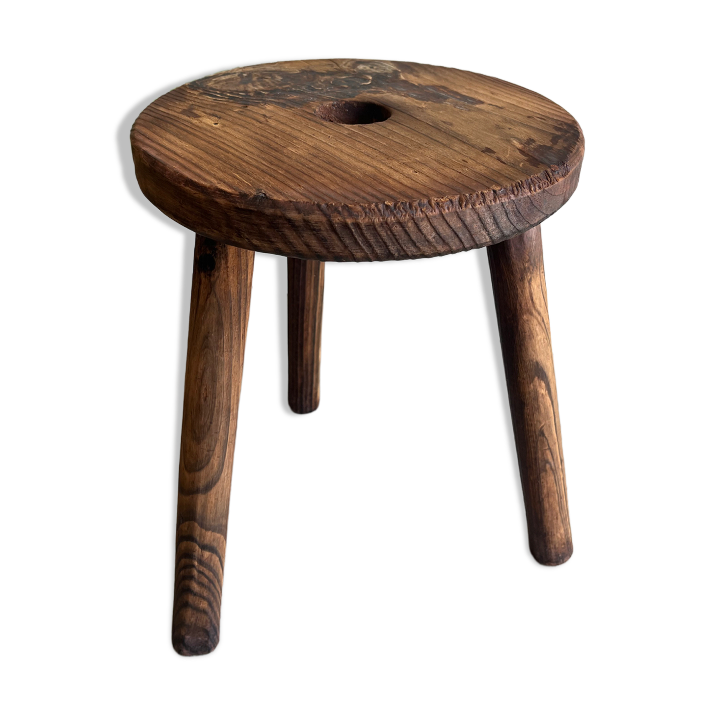 Three-legged wooden stool