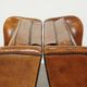 Set of 2 very comfortable large sheepskin armchairs elegantly finished with black piping