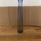 Translucent blue glass vase from the 1980s — tall prismatic silhouette, polygonal base.