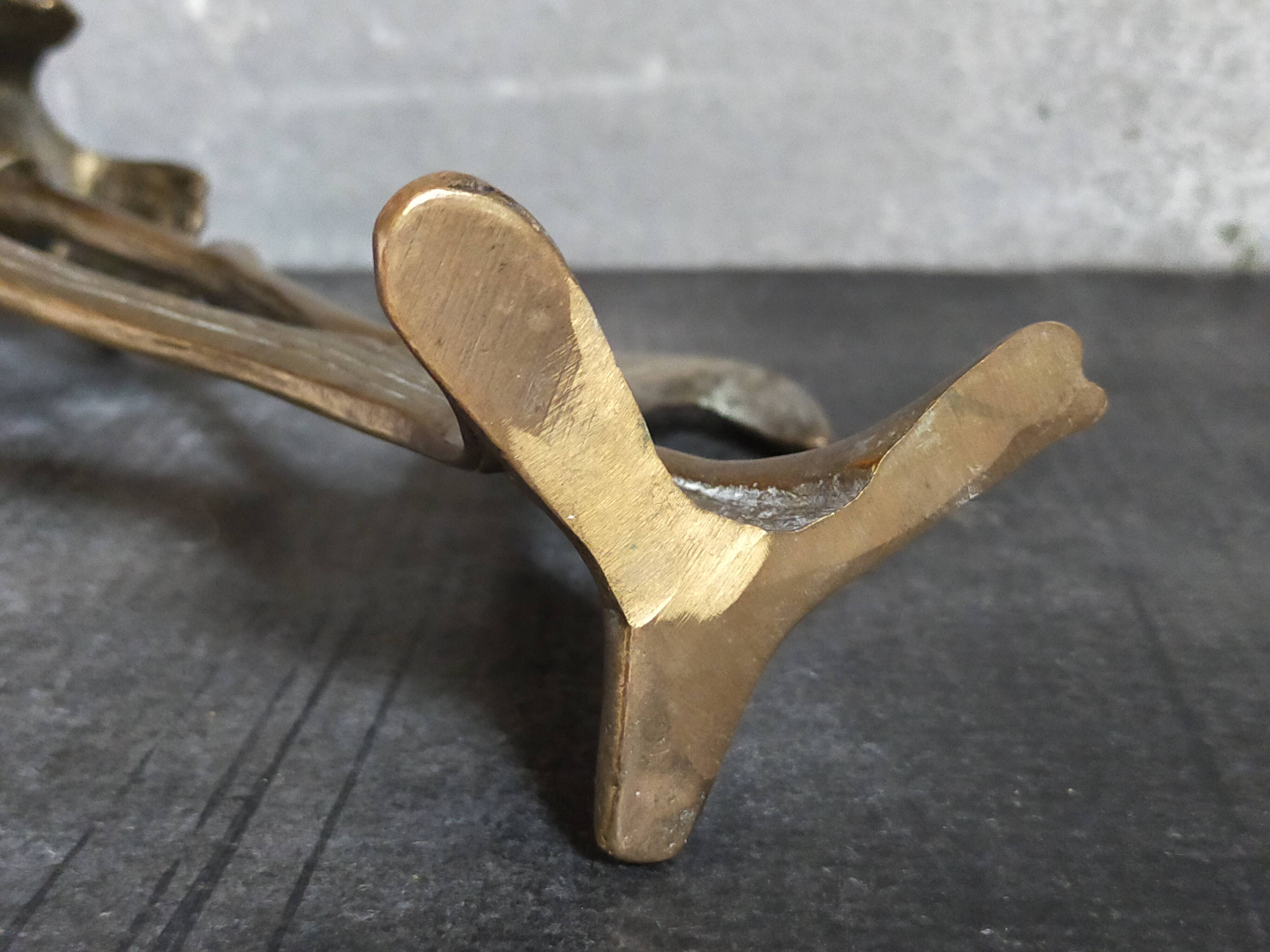 Old iris flower candle holder in solid brass