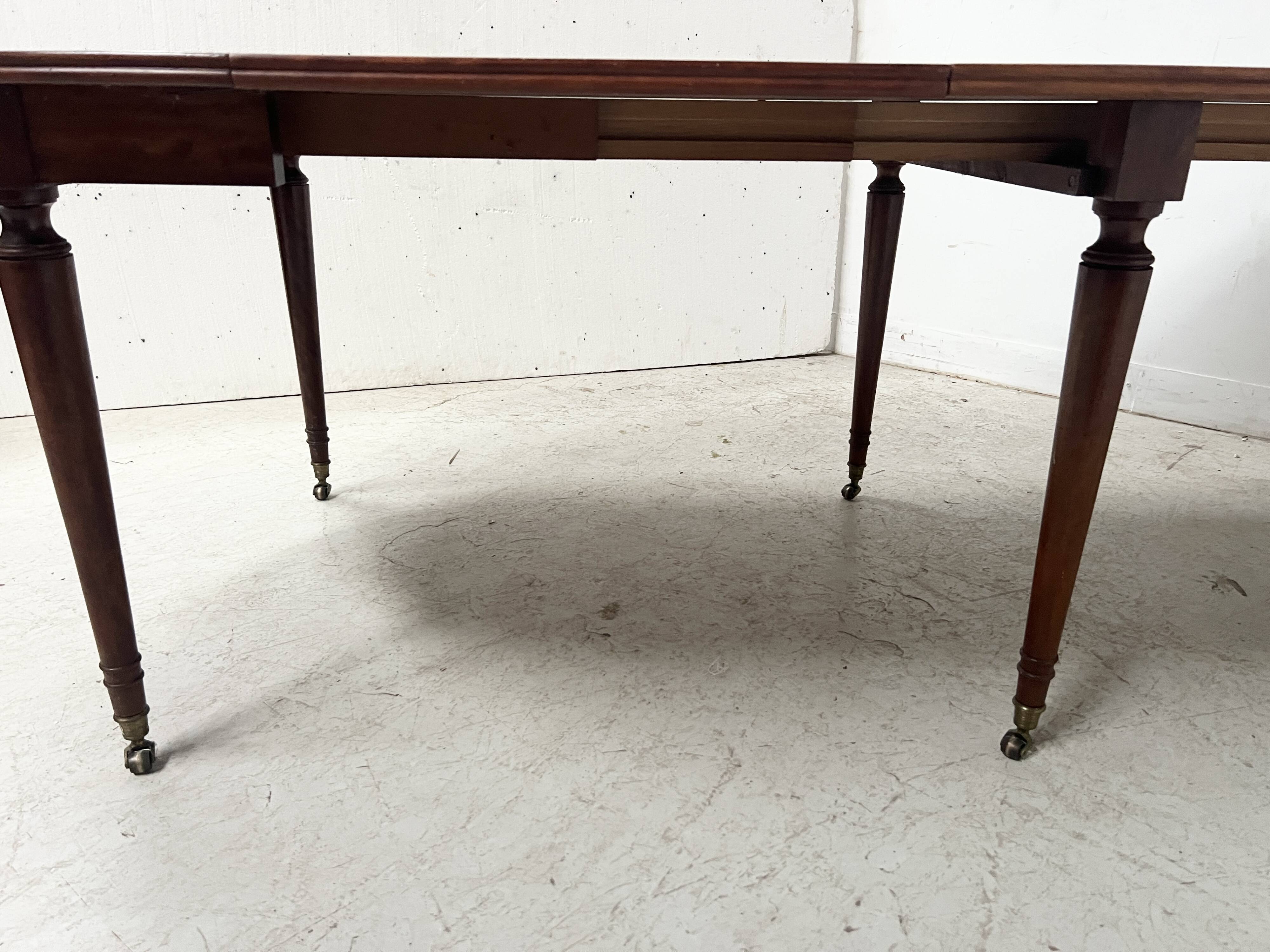 A six-foot Louis XVI style mahogany table from the 19th century.