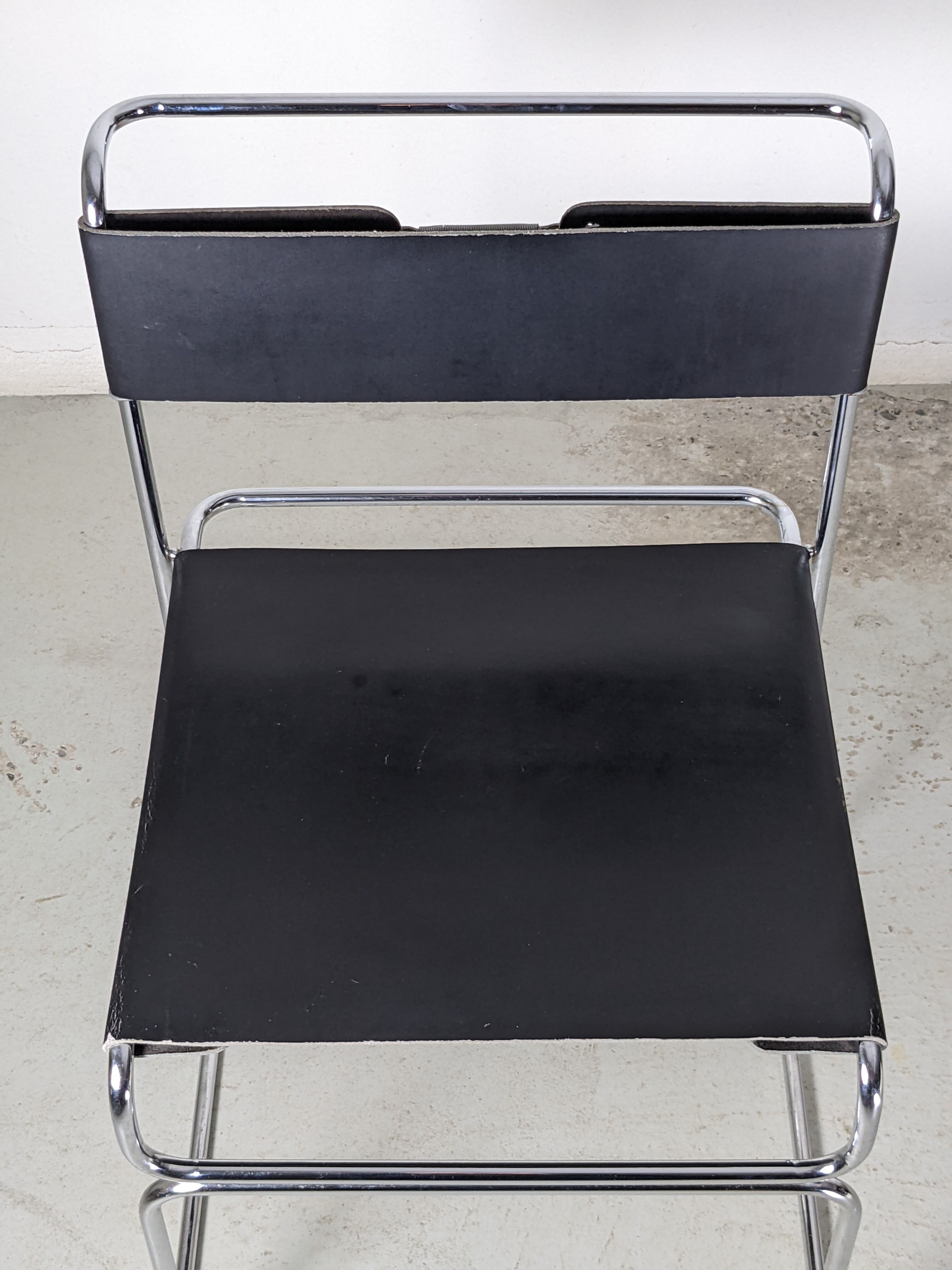 Suite of 4 chairs in chromed metal and leather by Giovanni Carini for Planula - 70s