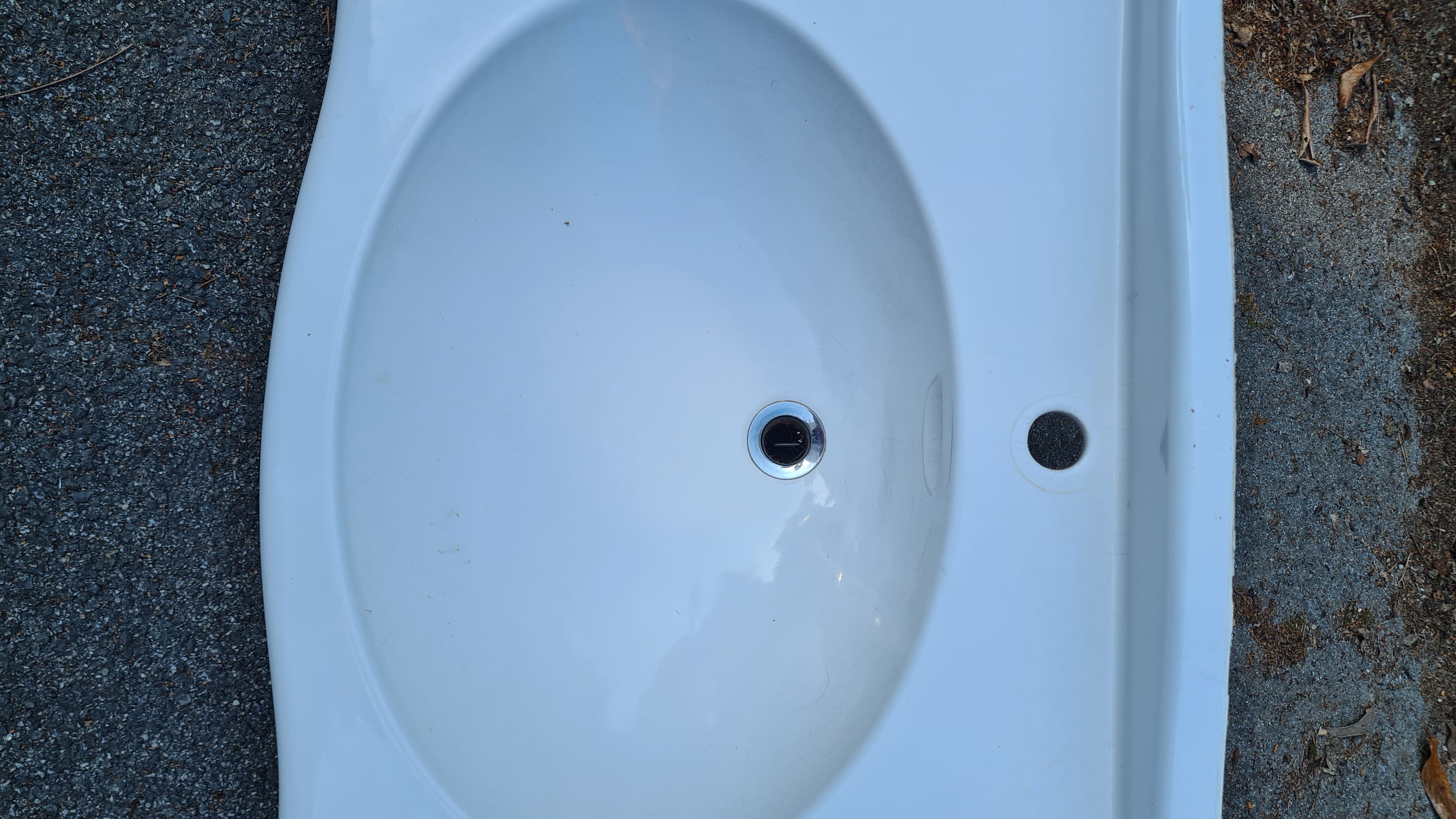 White ceramic wall washbasin with 2 ceramic legs