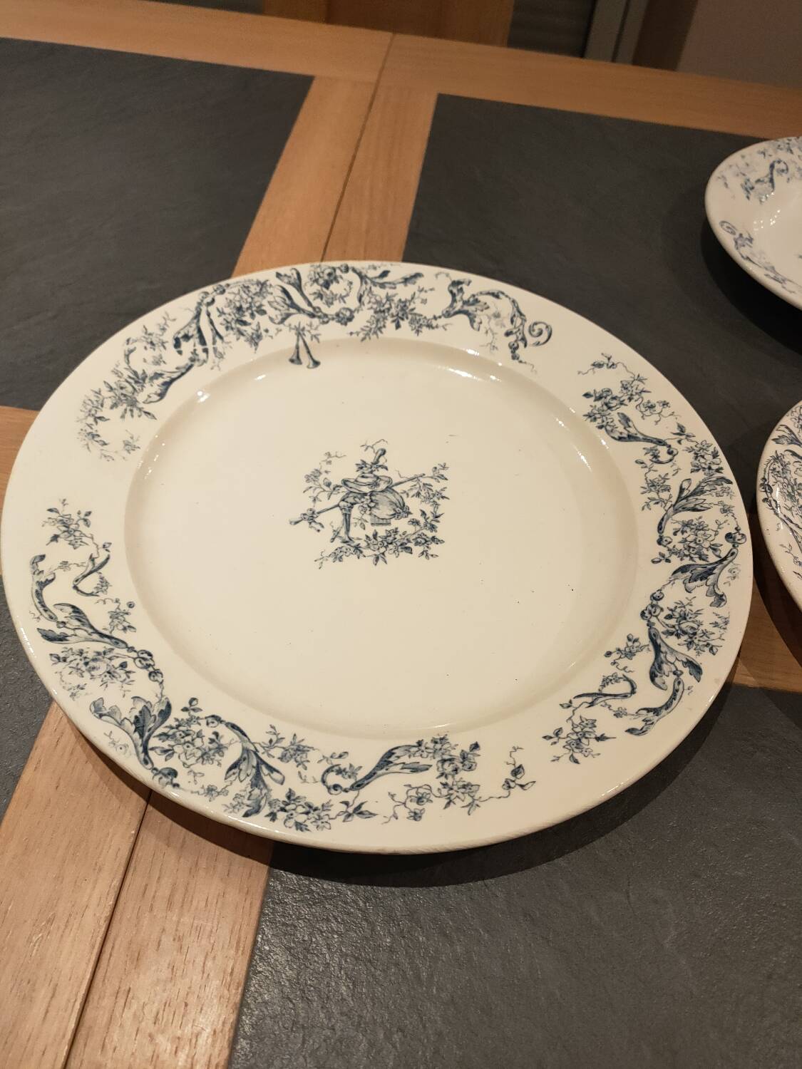 Service of old Gien earthenware plates and dishes