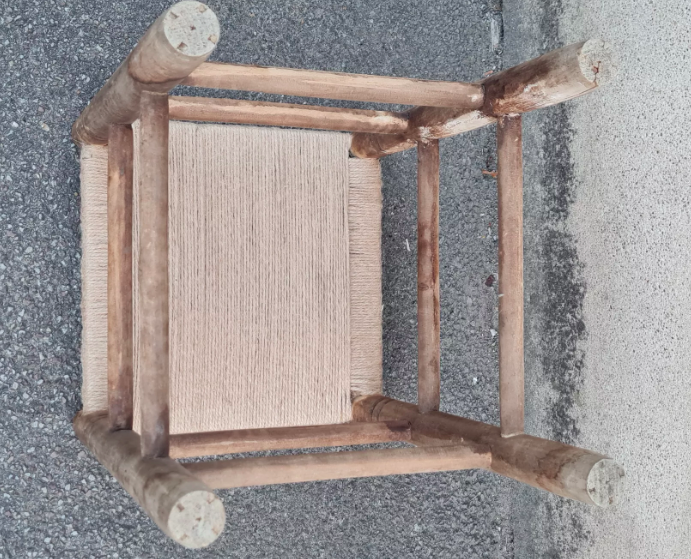 Vintage handmade wooden stool and rope