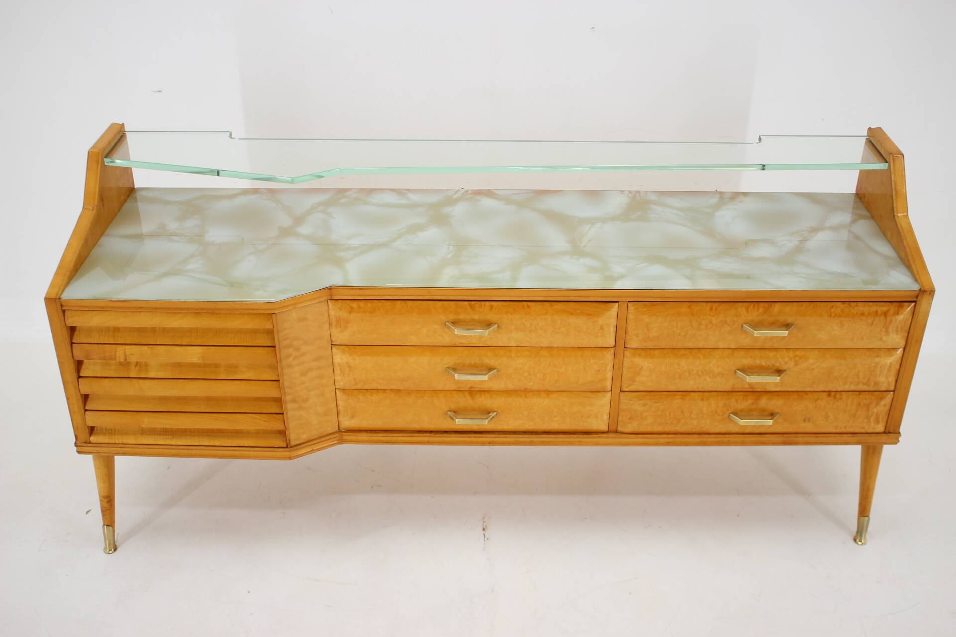 1960s italian sideboard/chest of drawers in high gloss finish with glass top and shelf