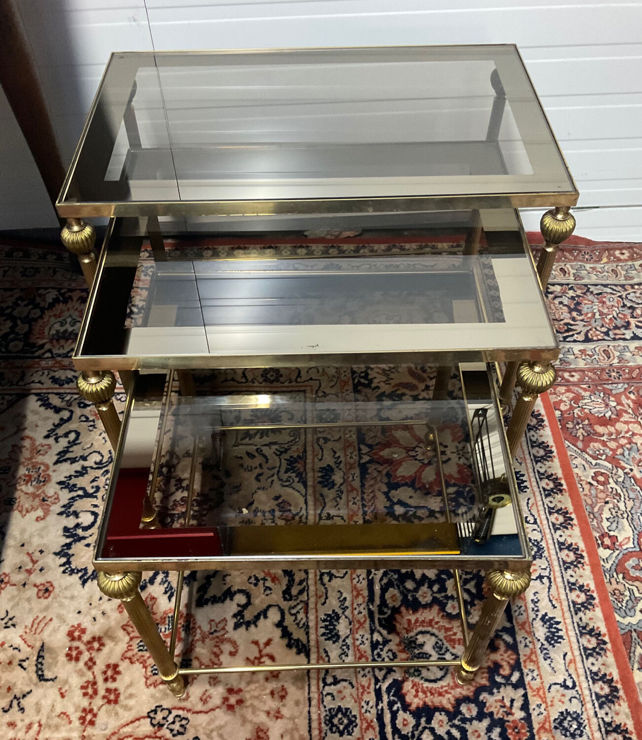 Series of 3 empire style nesting tables in brass and glass