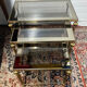 Series of 3 empire style nesting tables in brass and glass