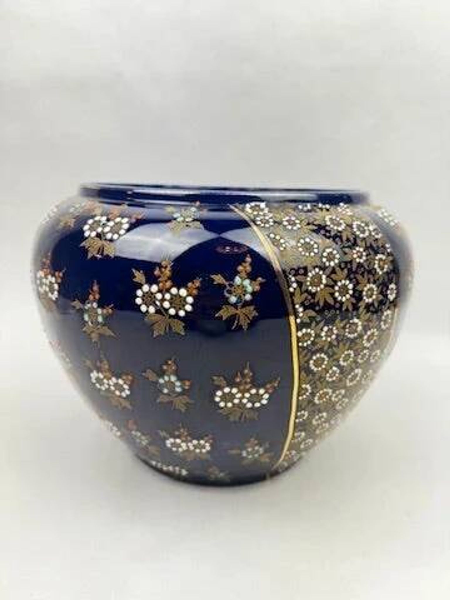Limoges porcelain flowerpot with gold enamel decoration and blue relief flowers from Four