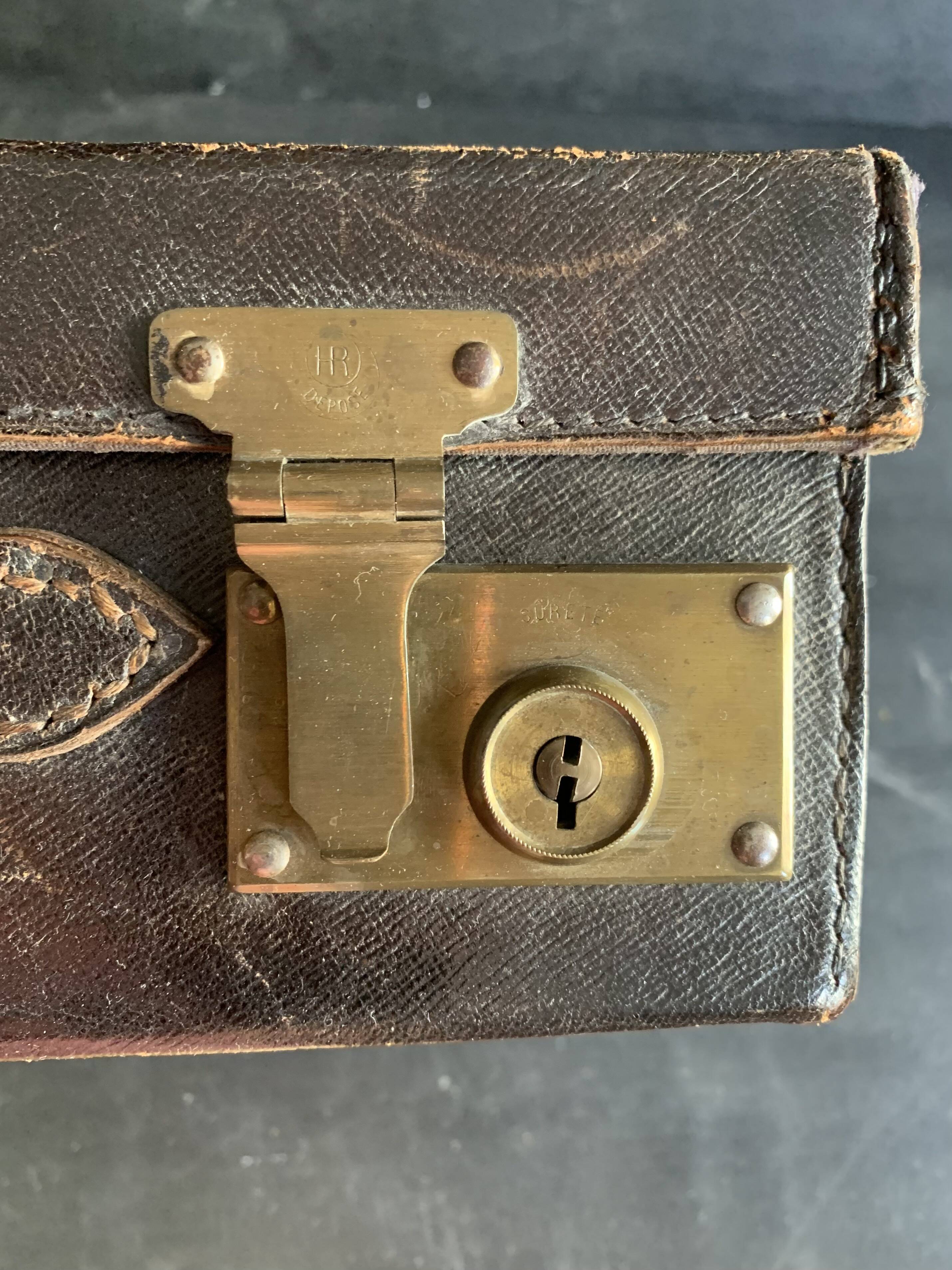 Small black grained leather travel suitcase from the 1920s