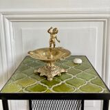 Brass cherub pocket-empty ashtray