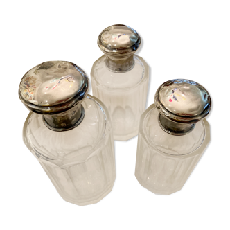 Faceted glass bottles and silver metal caps