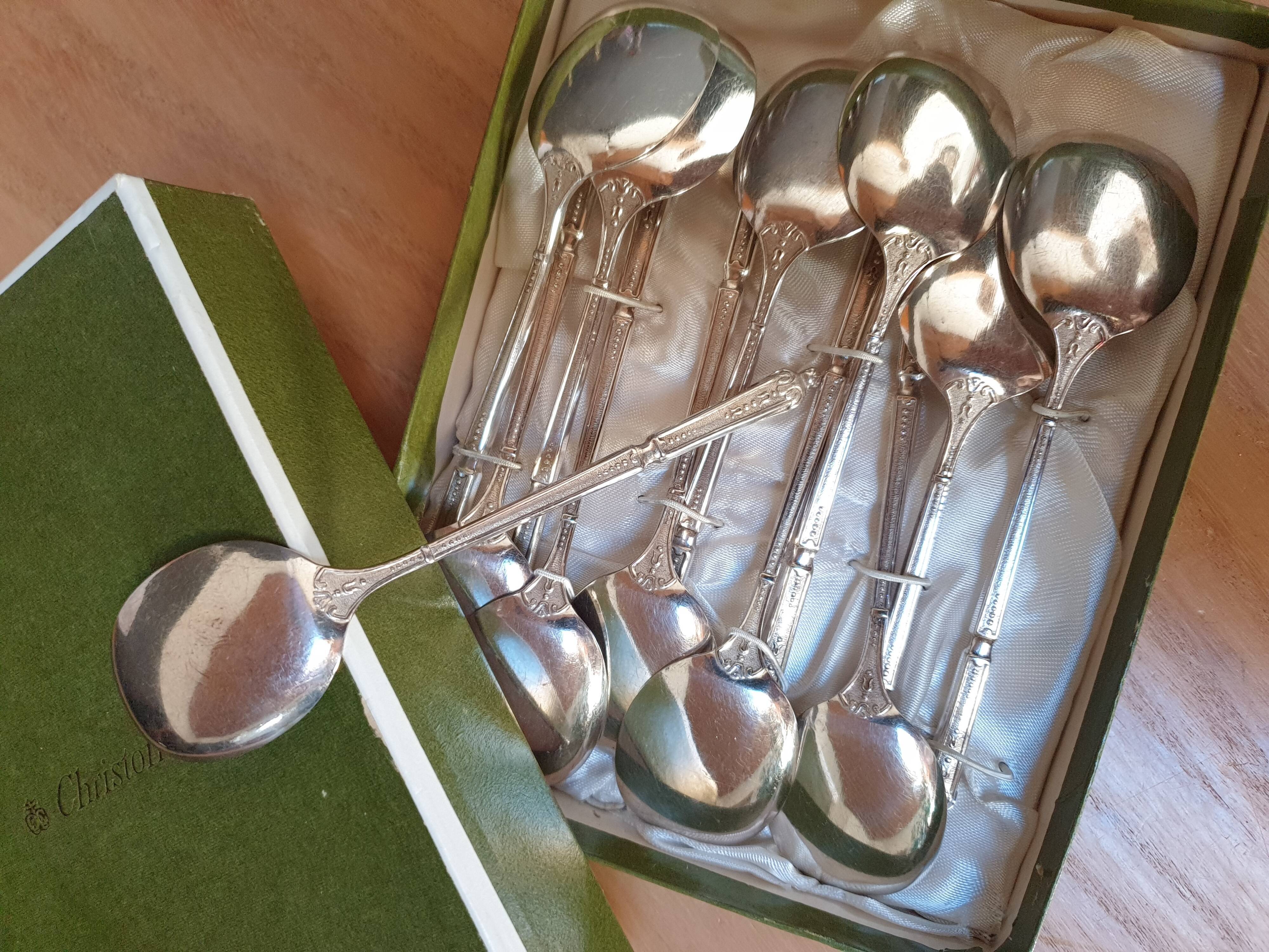 Punched silver metal ice spoons