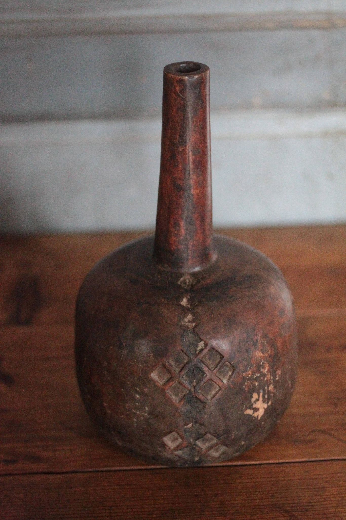 Vintage African wooden carved gourd bottle.