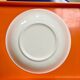 Vintage deep plate with vegetable decoration.