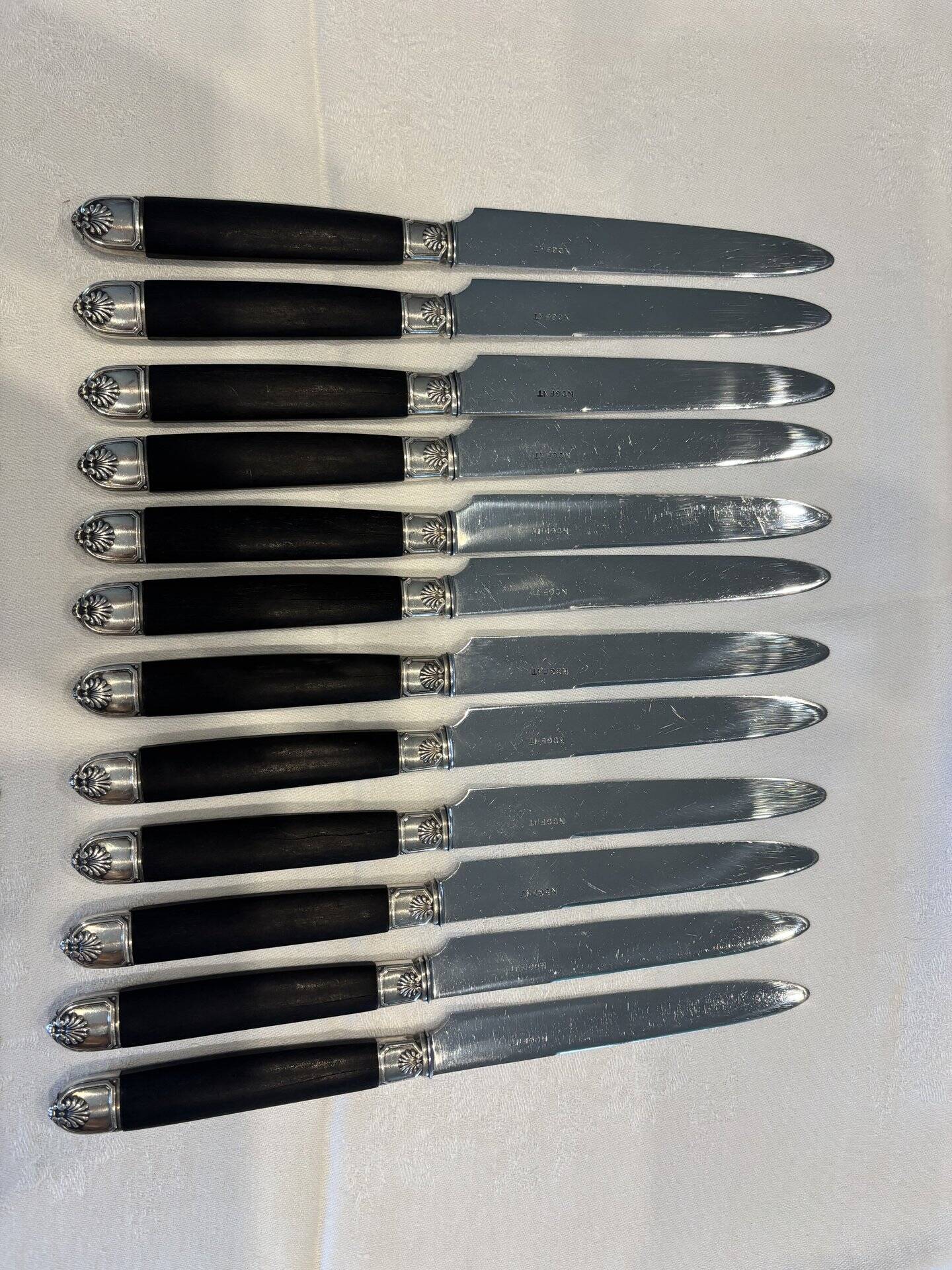 Empire-style knife set in ebony, with silver ferrules and pommels