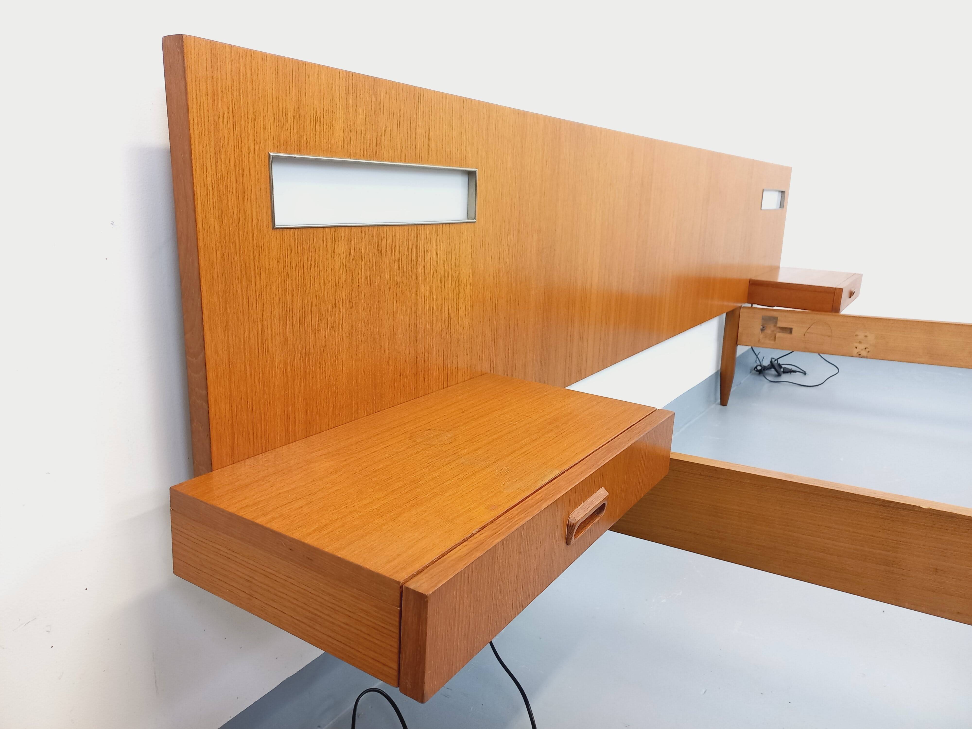 Double bed in vintage Scandinavian style from the 1960s with bedside tables.