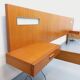 Double bed in vintage Scandinavian style from the 1960s with bedside tables.