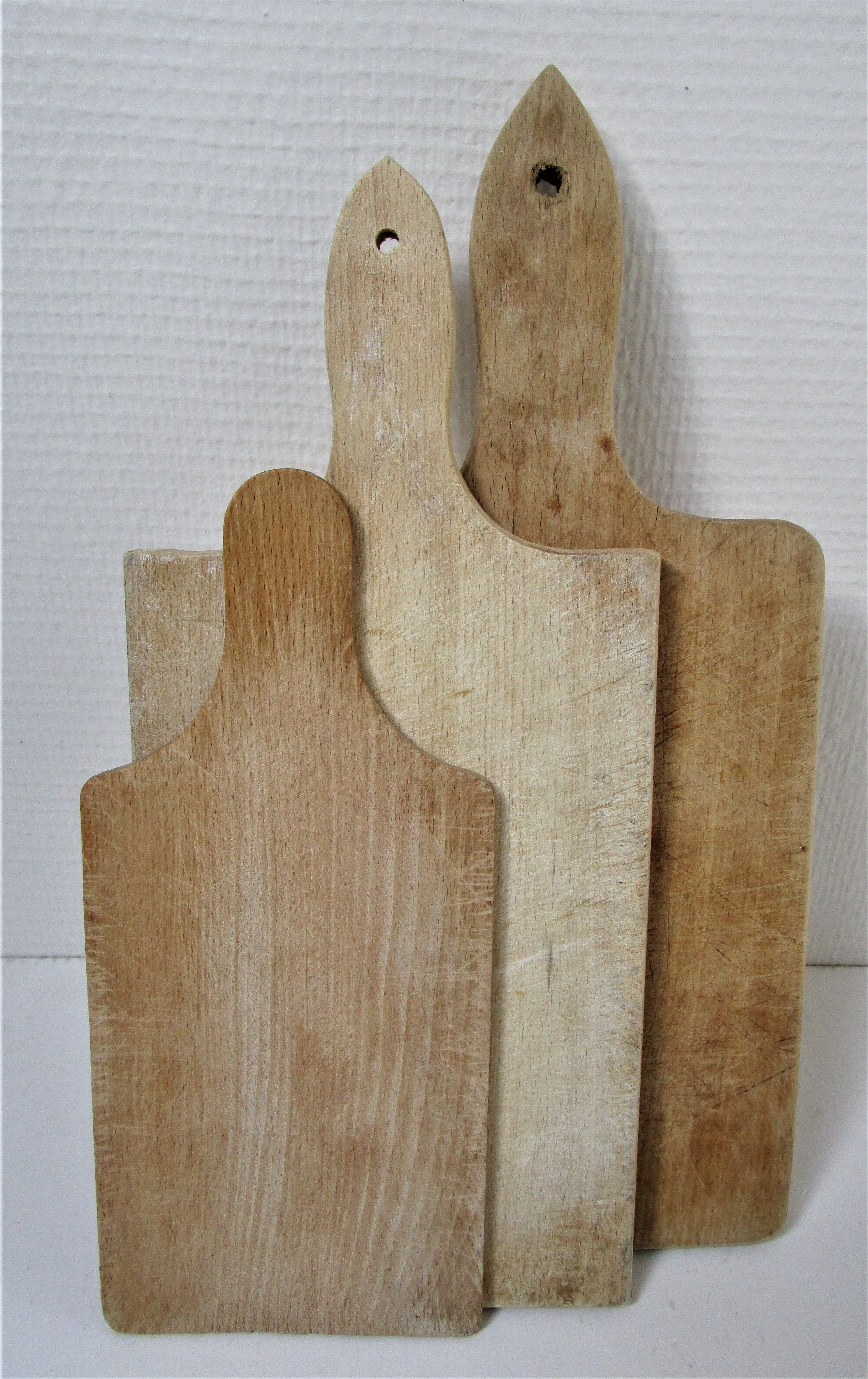 Three vintage solid wood cutting boards