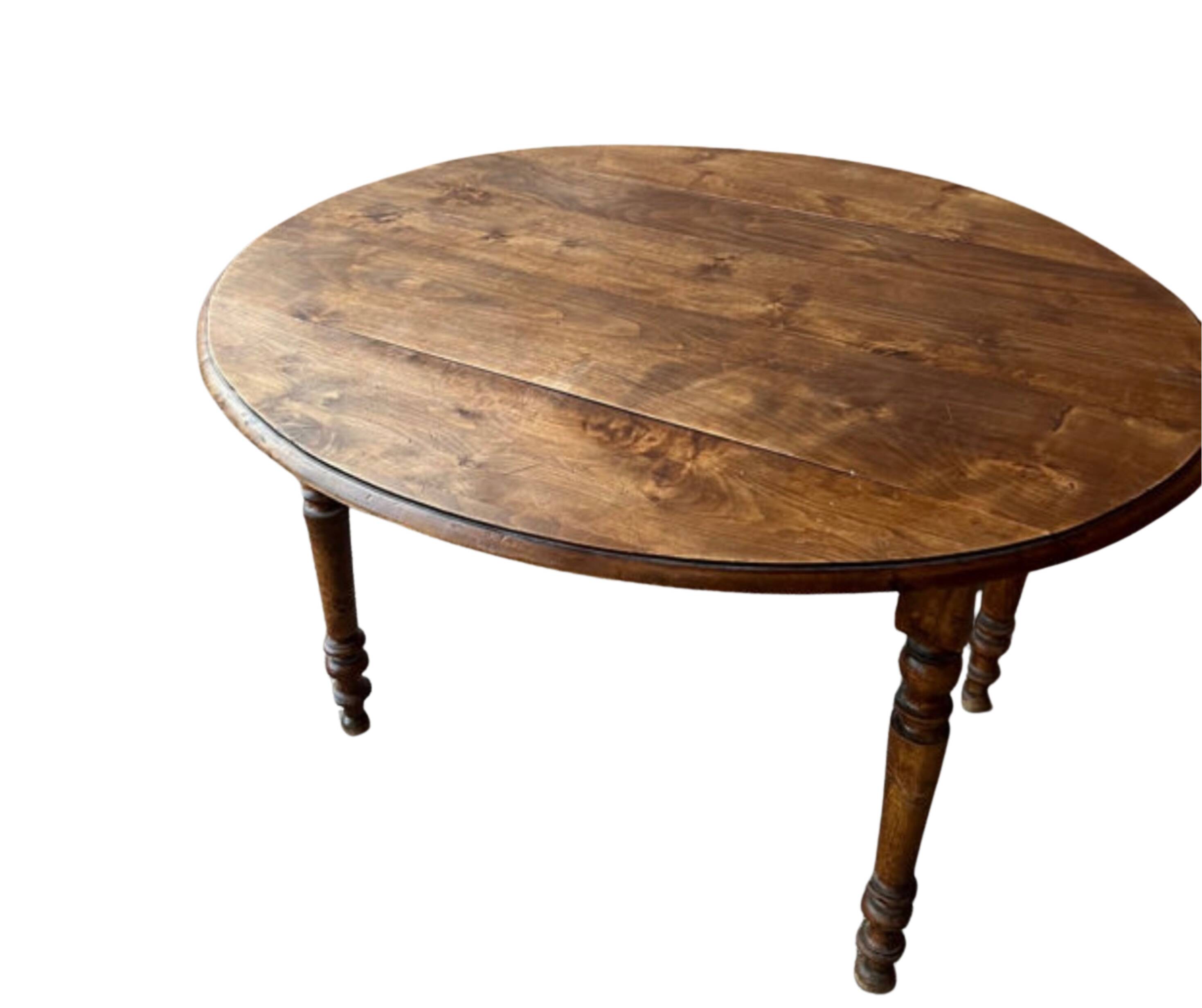 Round (foldable) table in solid wood (walnut)