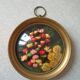 Old medallion frame bouquet of dried flowers glass and plastic retro decoration