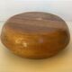 Round wooden pocket emptier