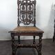 Set of 6 Henri II chairs in carved openwork oak with caned seats.