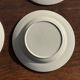 Set of 4 small dessert plates with a vintage stylised flower pattern.
