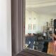 Beveled vintage mirror in painted wood 95x68cm