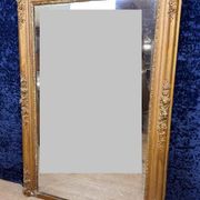 Empire period mirror in wood and gilded stucco circa 1810-1820
