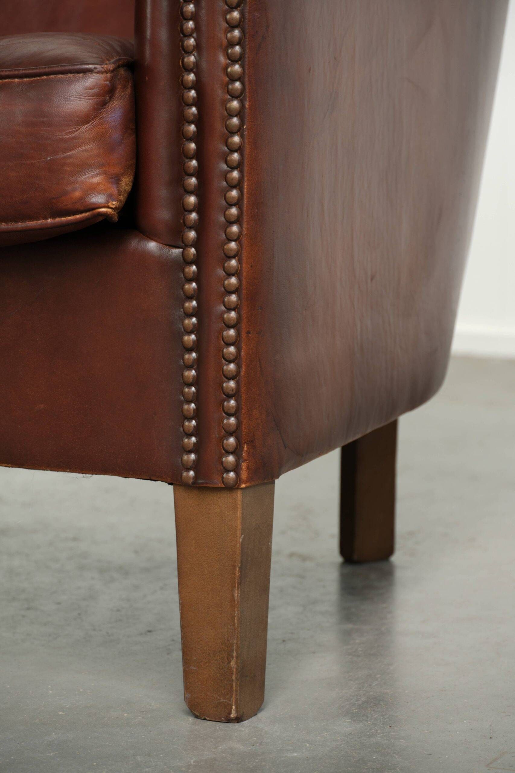 Sheepskin club armchair in English style with brown colour scheme