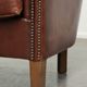 Sheepskin club armchair in English style with brown colour scheme